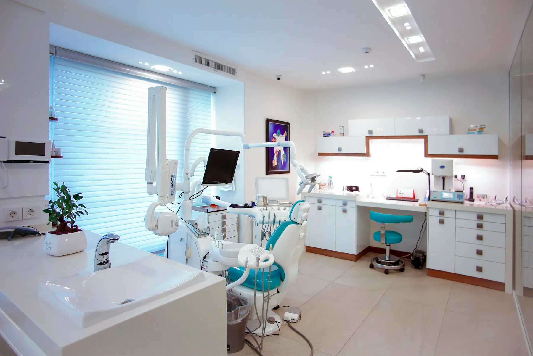 Modern treatment room with a dental chair