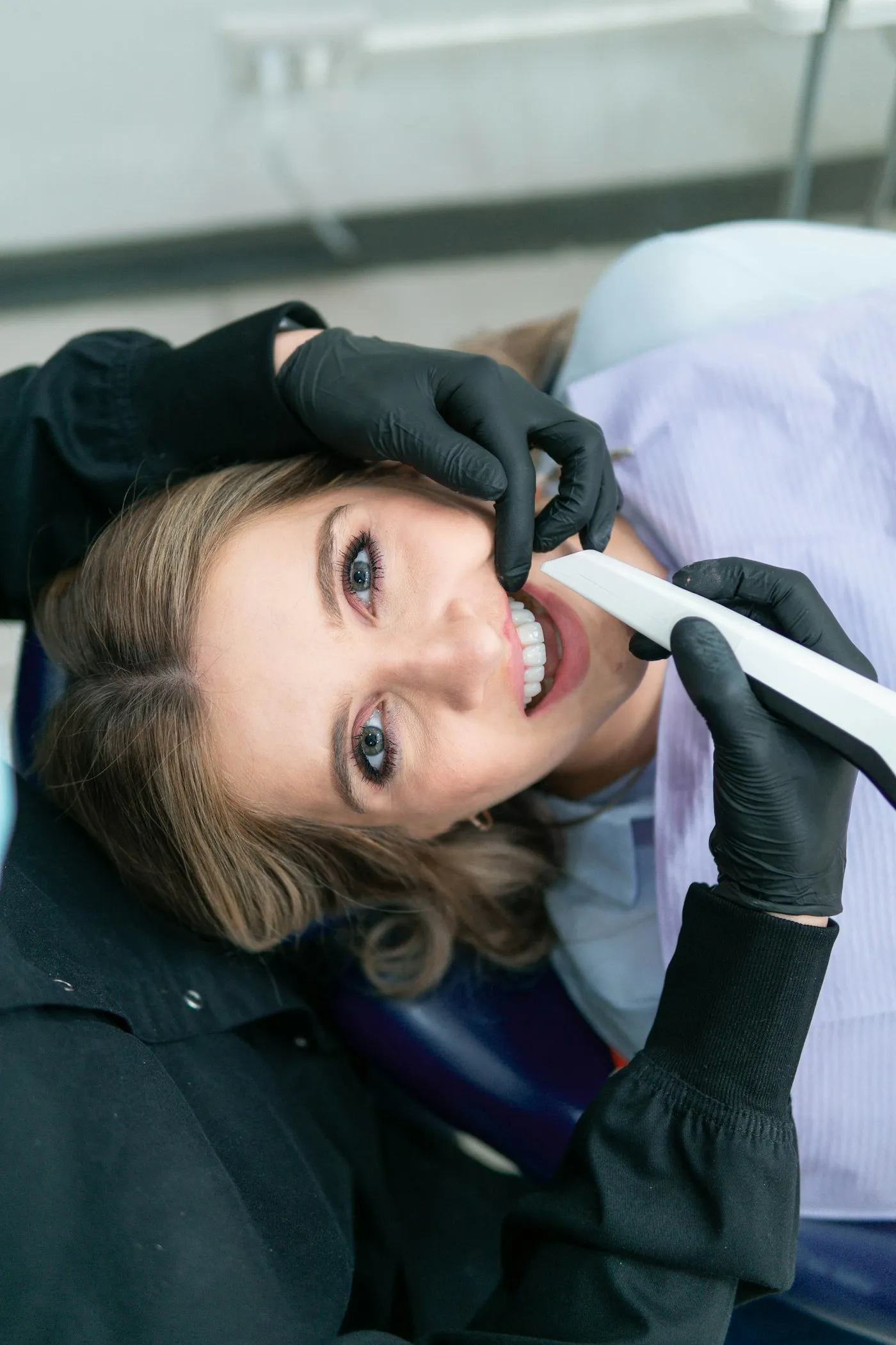 Smiling patient during a gentle dental treatment